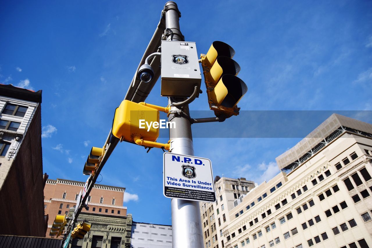 LOW ANGLE VIEW OF ROAD SIGN