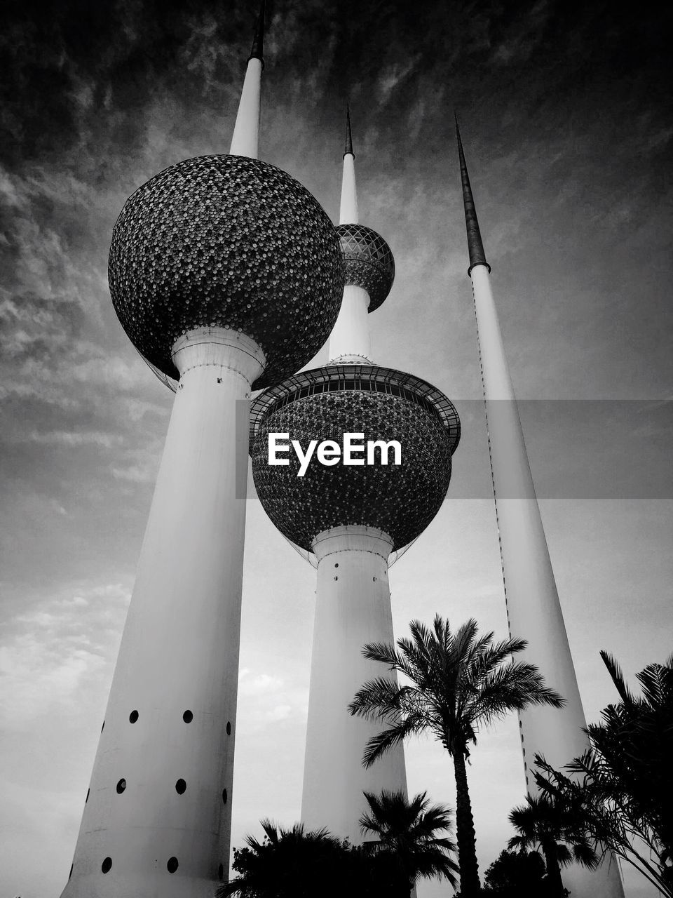 Low angle view of kuwait towers against sky in city