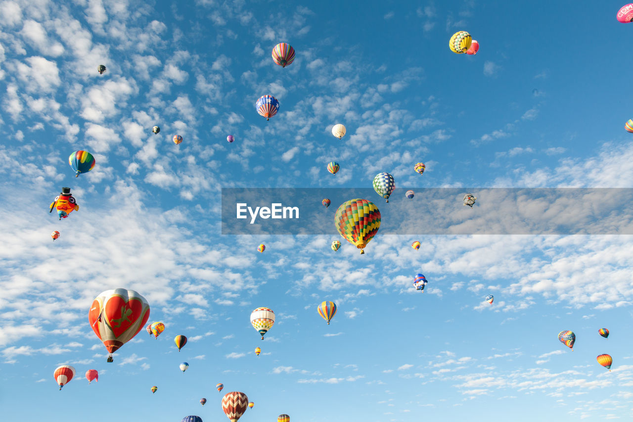 Low angle view of hot air balloons against sky