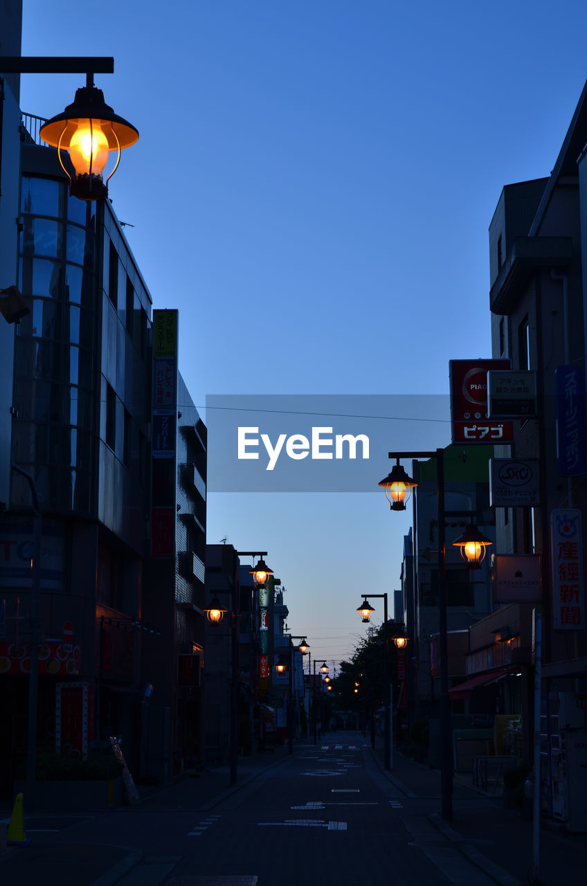 ILLUMINATED STREET LIGHTS AT NIGHT