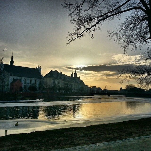 RIVER WITH BUILDINGS IN BACKGROUND