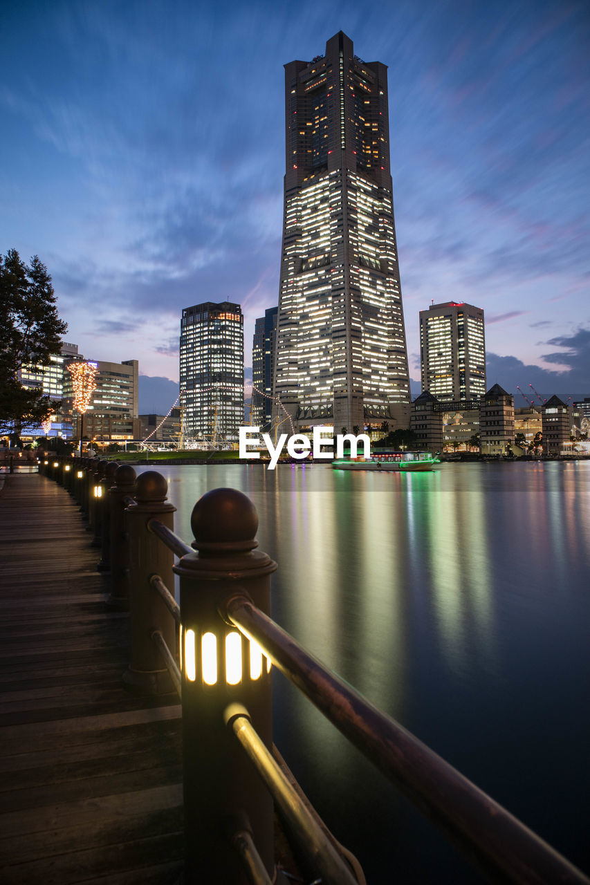 Illuminated buildings against sky at night in minato mirai, yokohama.