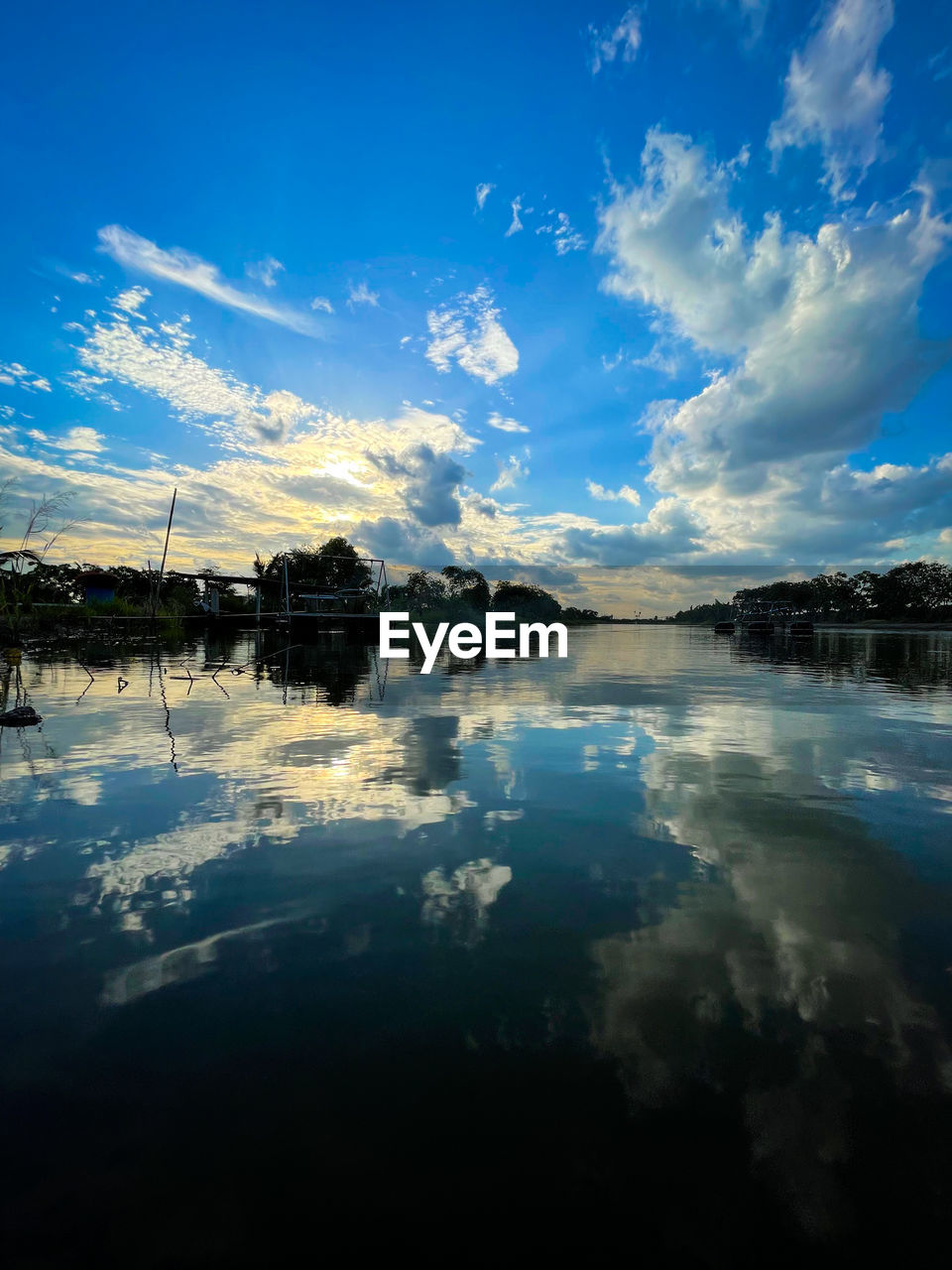 reflection, sky, water, cloud, scenics - nature, dusk, beauty in nature, sea, nature, sunlight, morning, blue, horizon, environment, tranquility, landscape, tranquil scene, body of water, no people, sunrise, land, shore, travel destinations, tree, wave, mountain, outdoors, non-urban scene, idyllic, ocean, travel, lagoon, coast, plant