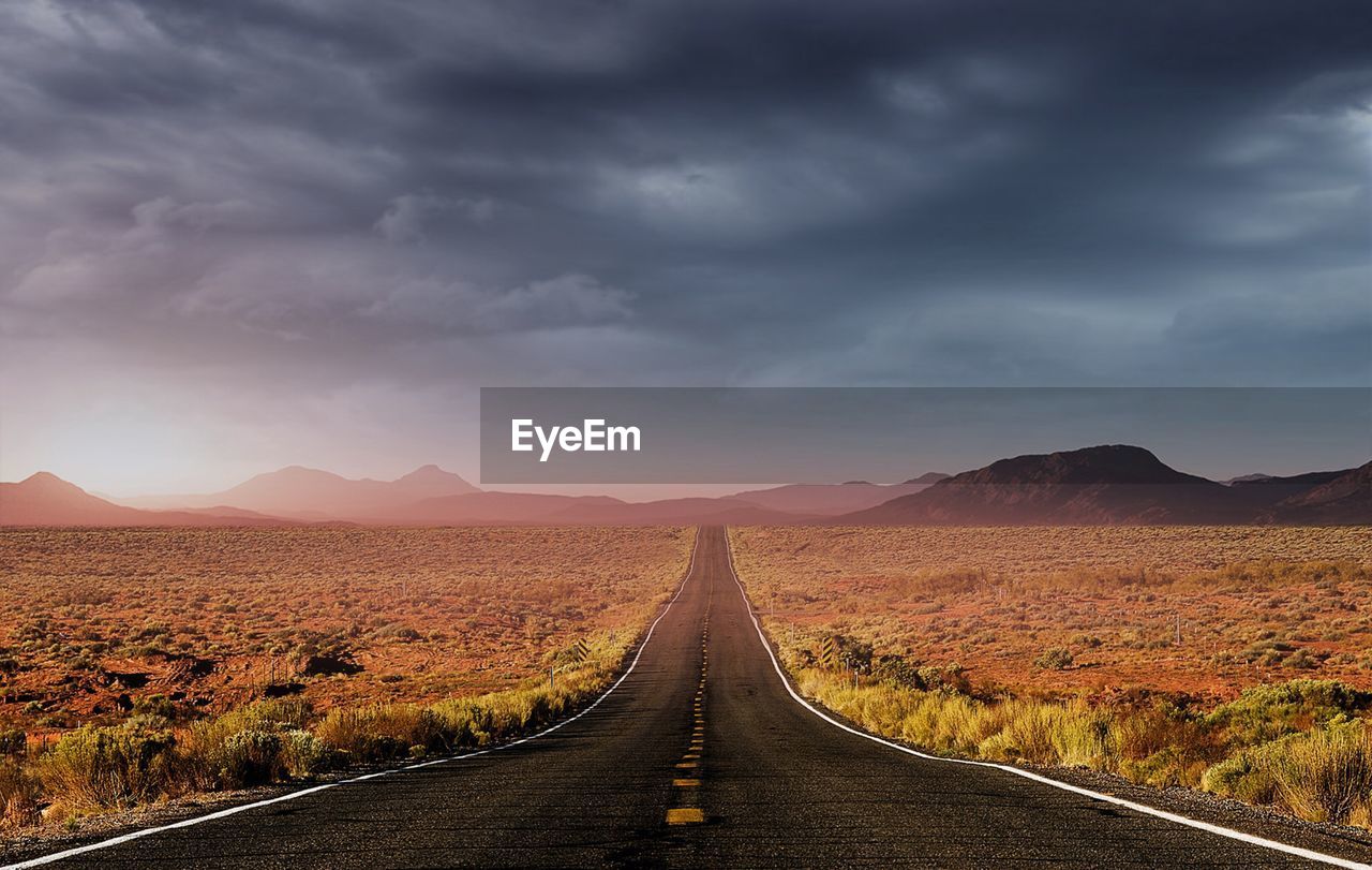 Road amidst landscape against sky