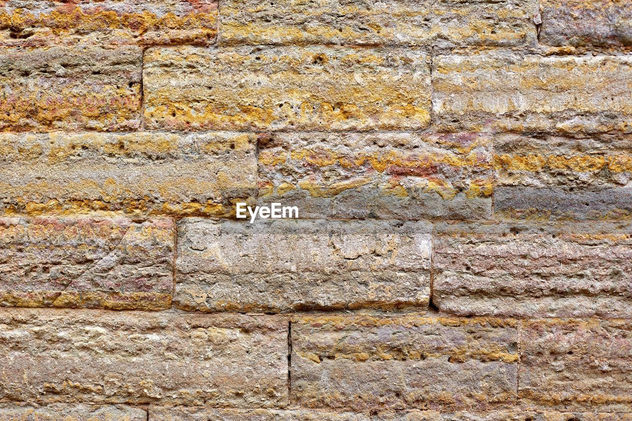 Full frame shot of weathered brick wall