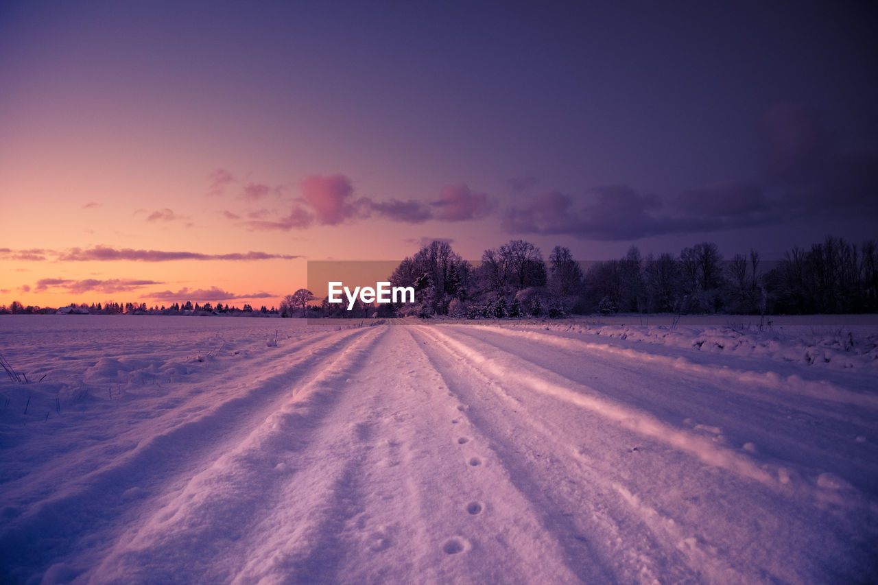 A beautiful winter morning landscape with a gravel road. bright, extra colorful scenery.