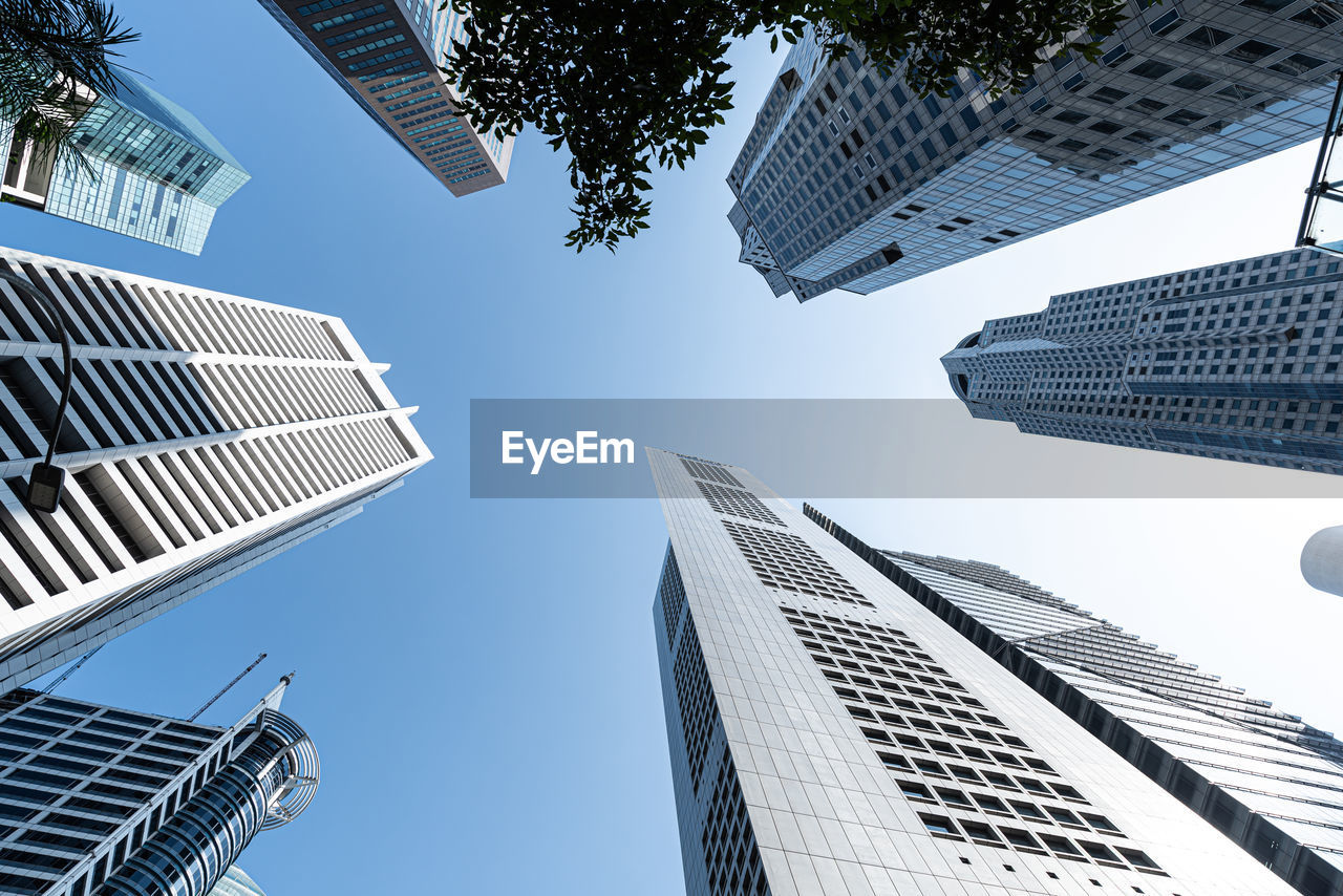 LOW ANGLE VIEW OF BUILDINGS AGAINST SKY IN CITY