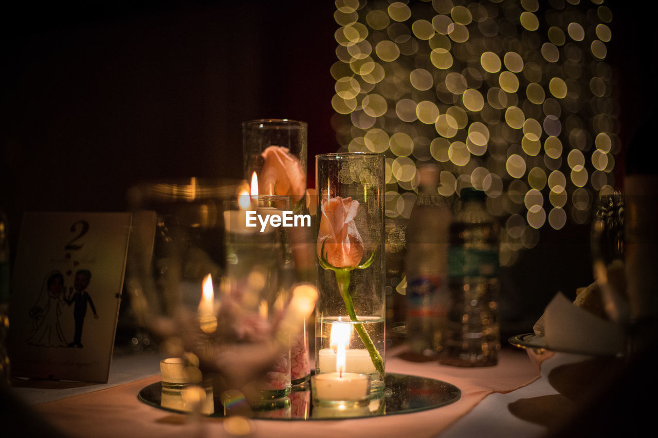 Close-up of candles in dark room