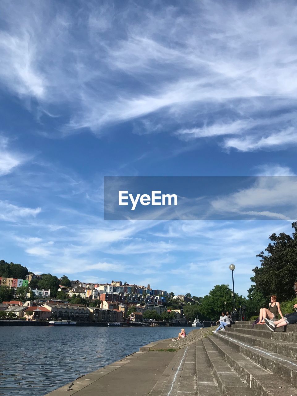 VIEW OF CITY BY SEA AGAINST SKY