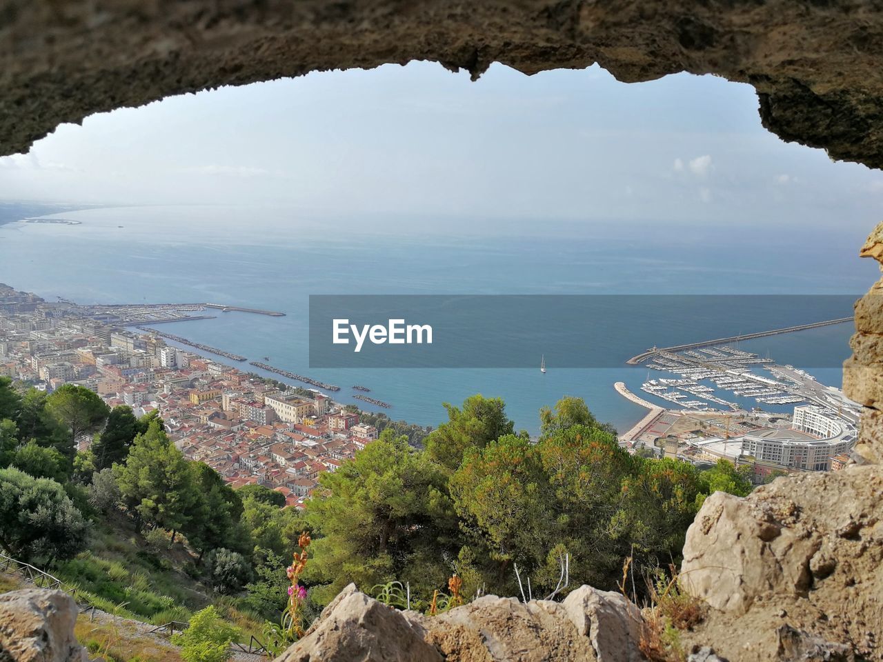 Aerial view of cityscape by sea