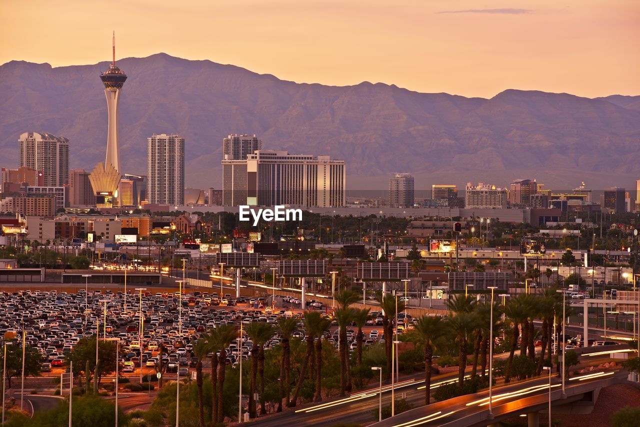 View of buildings in city at sunset