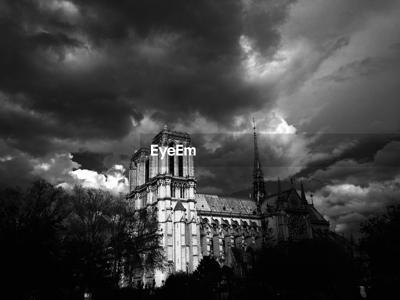 Notre dame cathedral paris, dramatic clouds