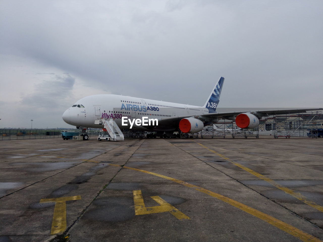 AIRPLANE ON AIRPORT RUNWAY