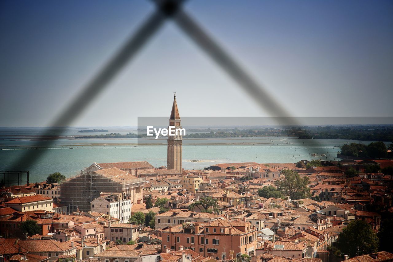 View of cityscape against sea