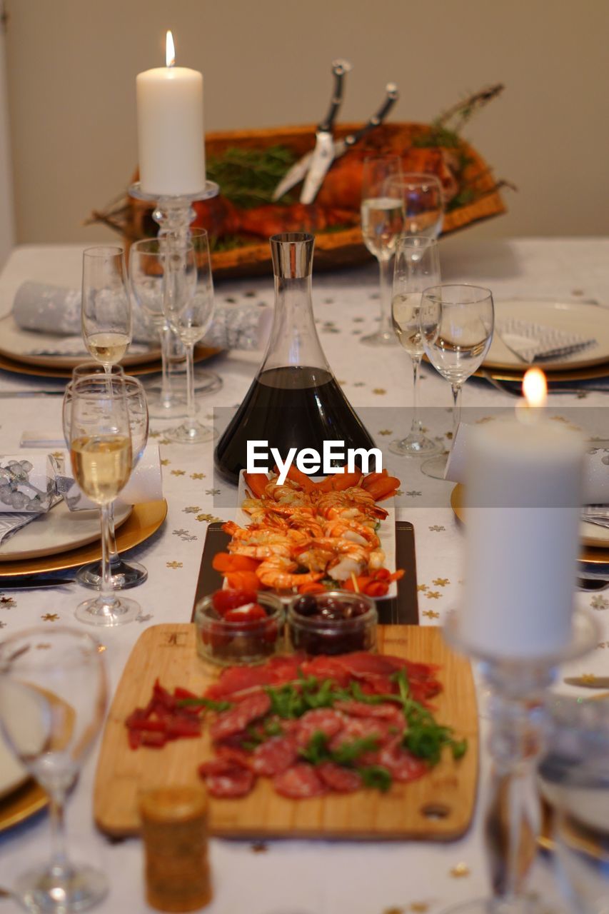 Close-up of wine glasses on table