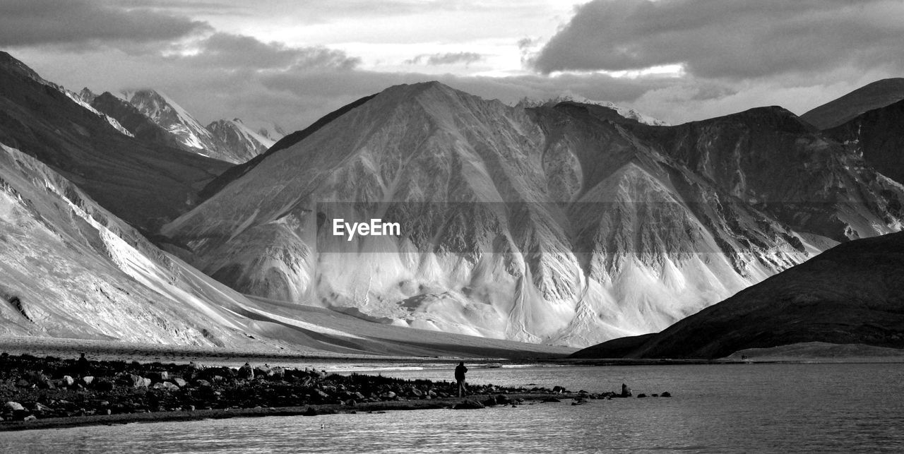 Scenic view of river against mountains