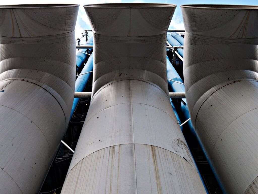 Low angle view of chimneys of a factory