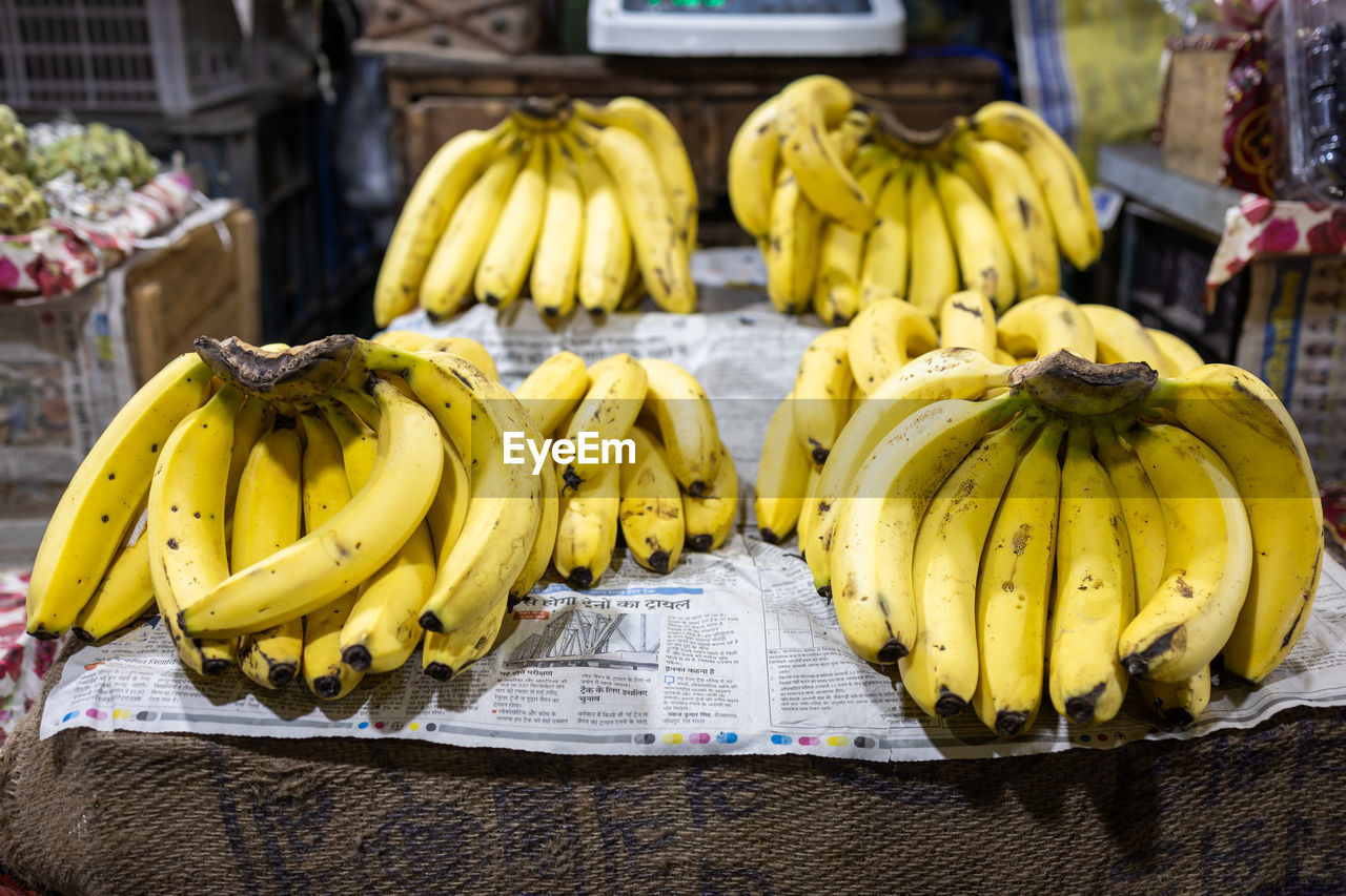 Fresh yellow ripe banana at fruit store for sale at evening