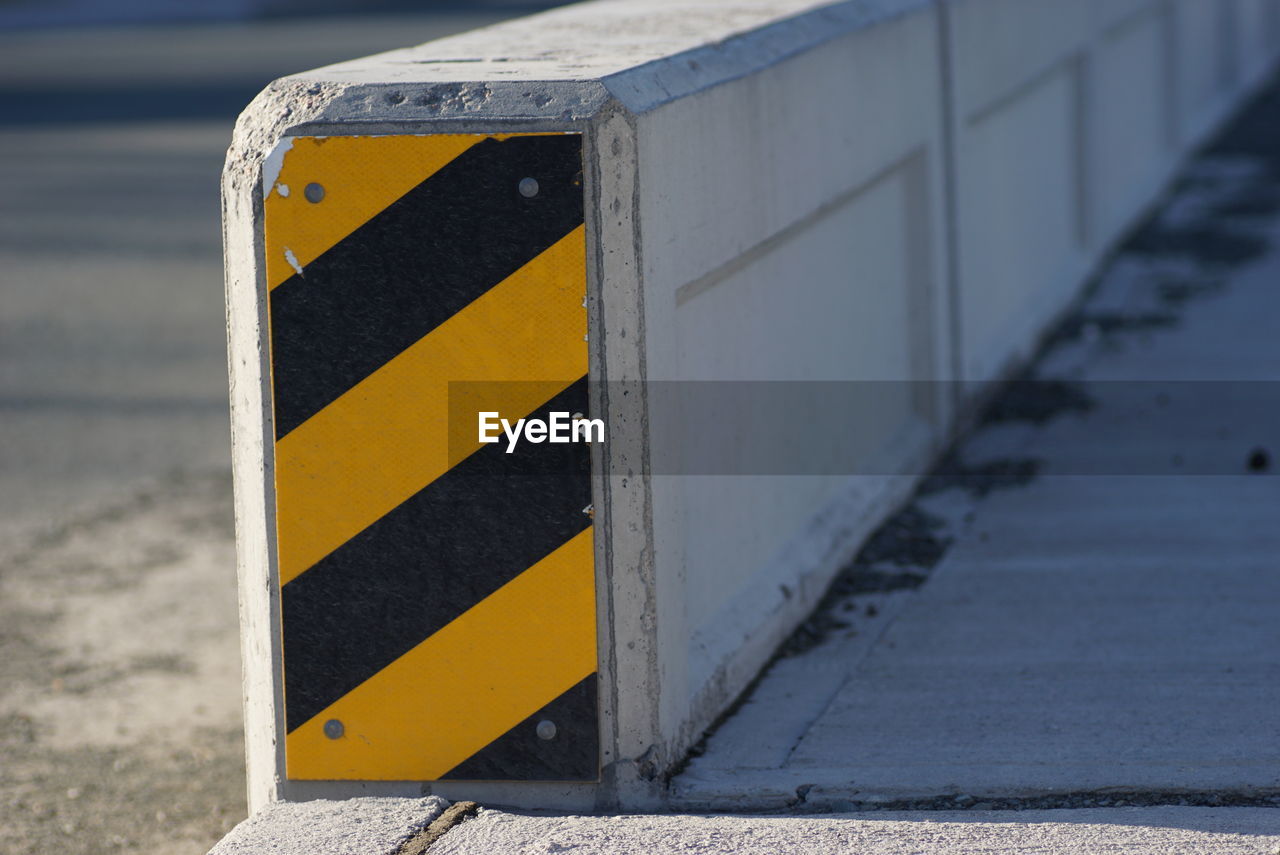 CLOSE-UP OF YELLOW FLAG