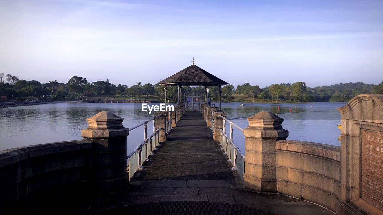 VIEW OF PIER ON LAKE AGAINST SKY