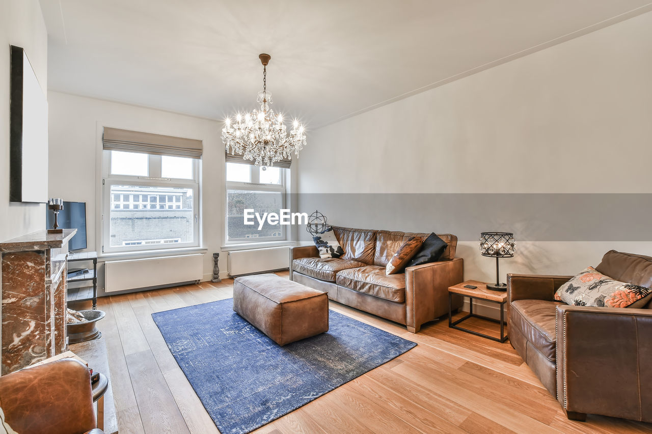 View of sofa by wall in living room