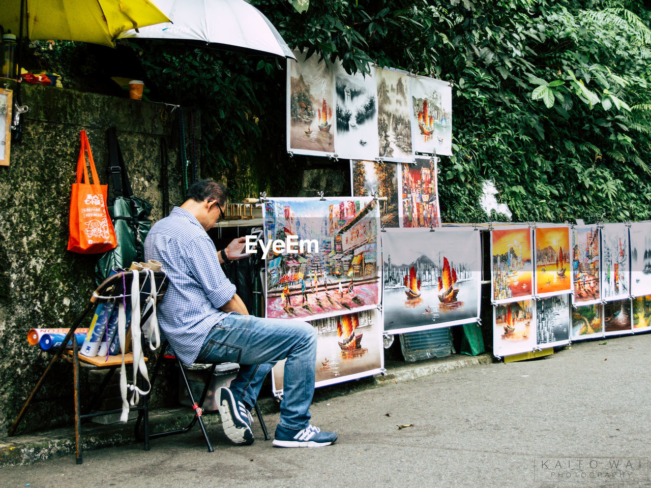 YOUNG MAN RELAXING ON ROAD