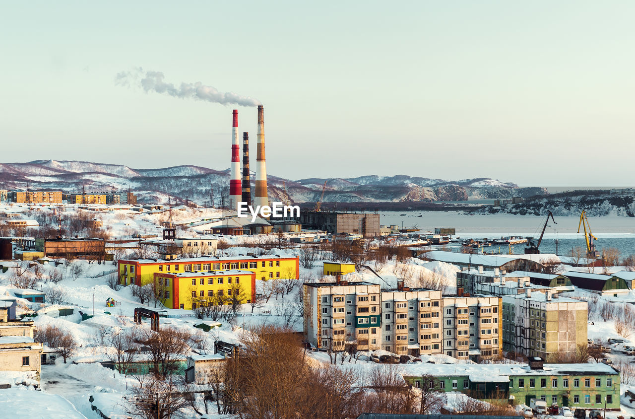 Chimneys in city during winter