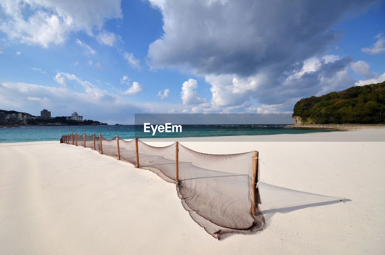 View of calm beach against the sky