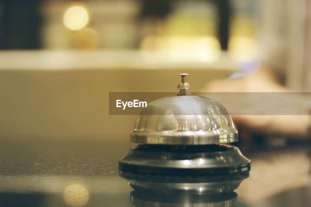 Close-up of service bell on table