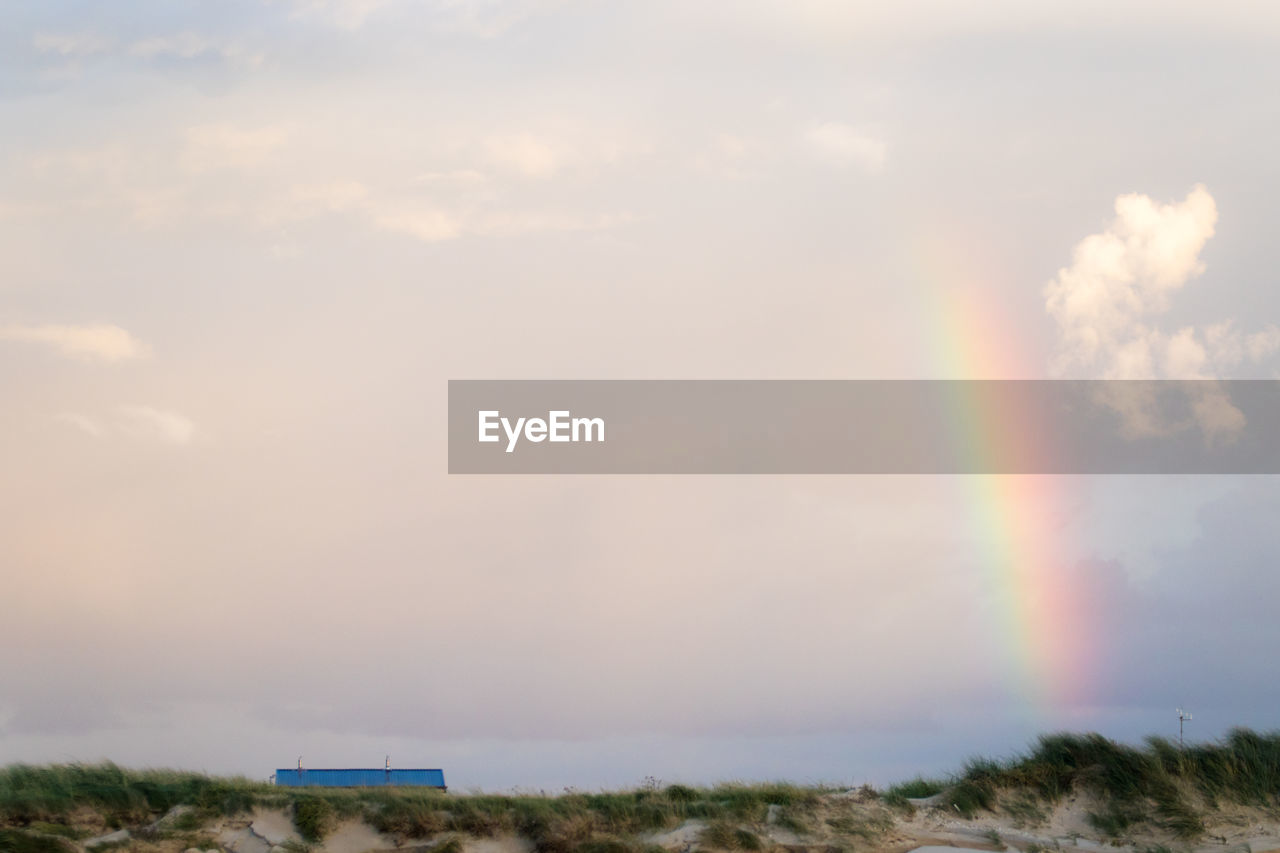 RAINBOW OVER LANDSCAPE