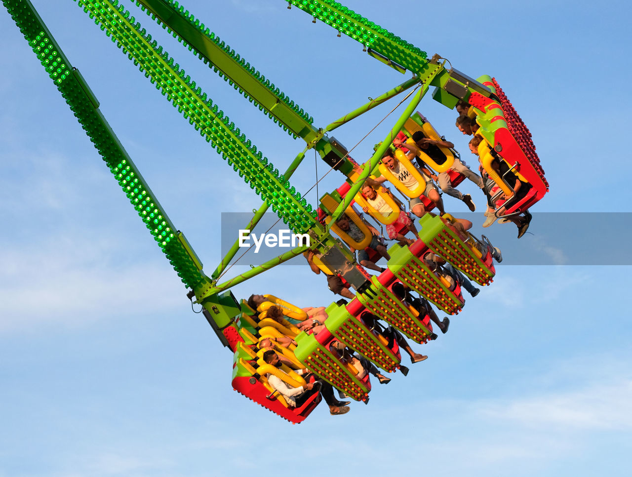 LOW ANGLE VIEW OF CAROUSEL AGAINST SKY