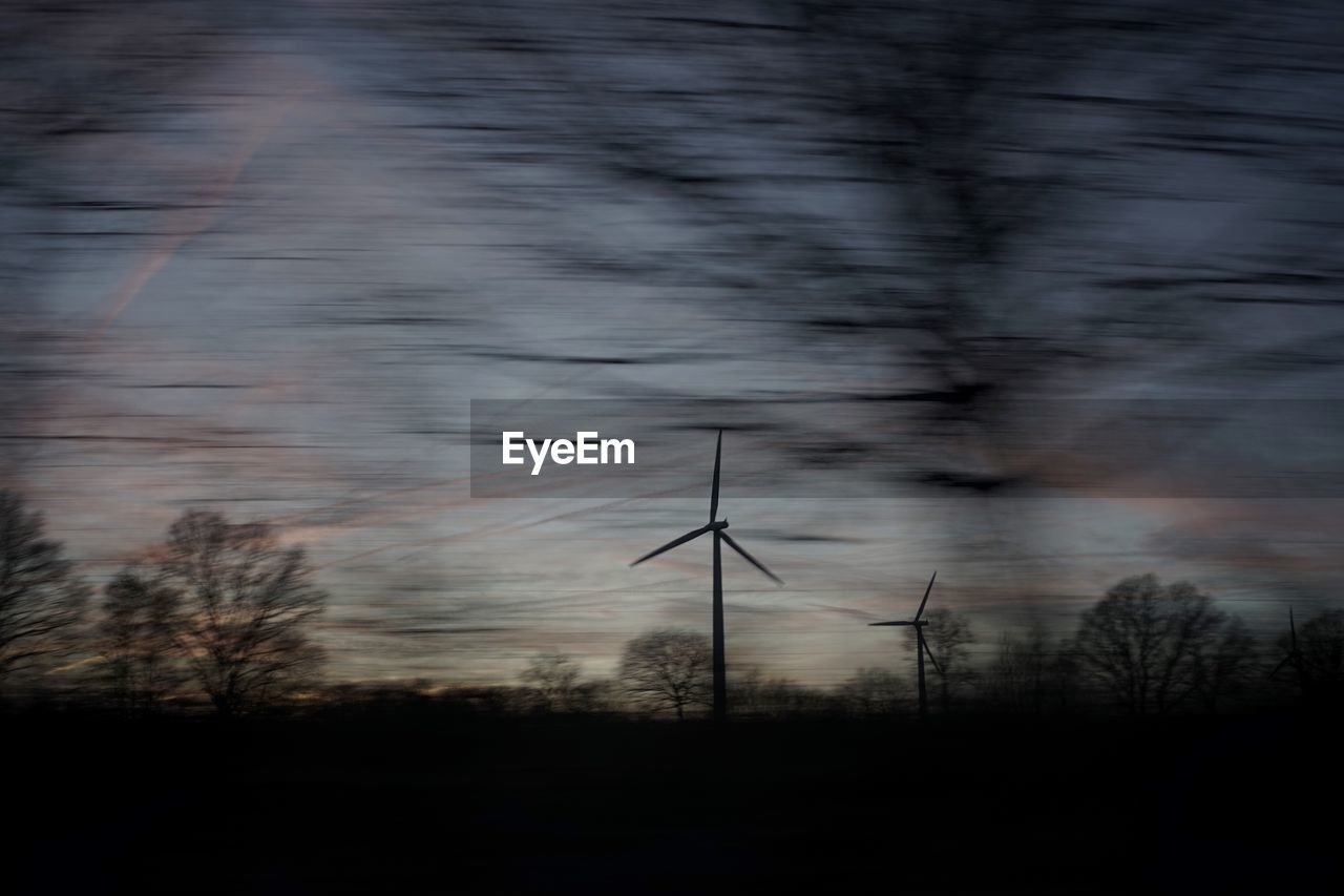 LOW ANGLE VIEW OF ELECTRICITY PYLON ON FIELD