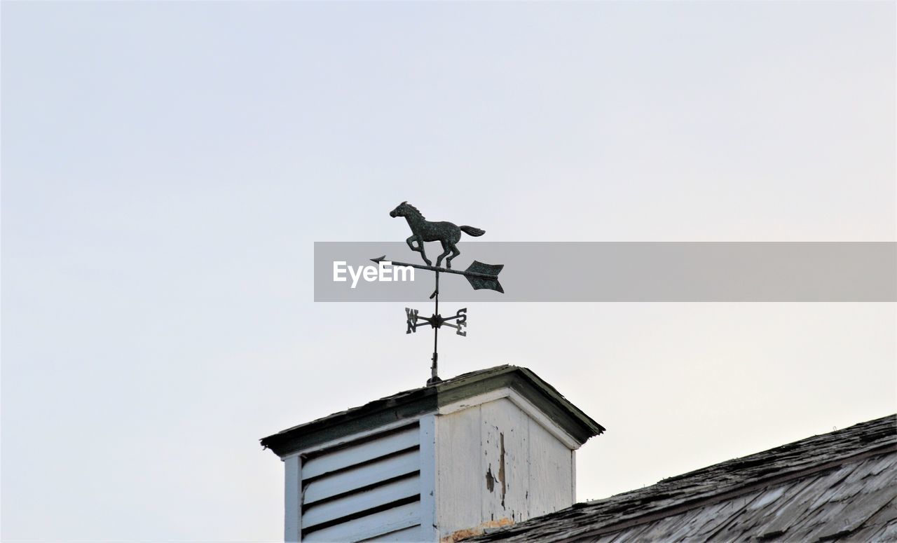 LOW ANGLE VIEW OF WEATHER VANE