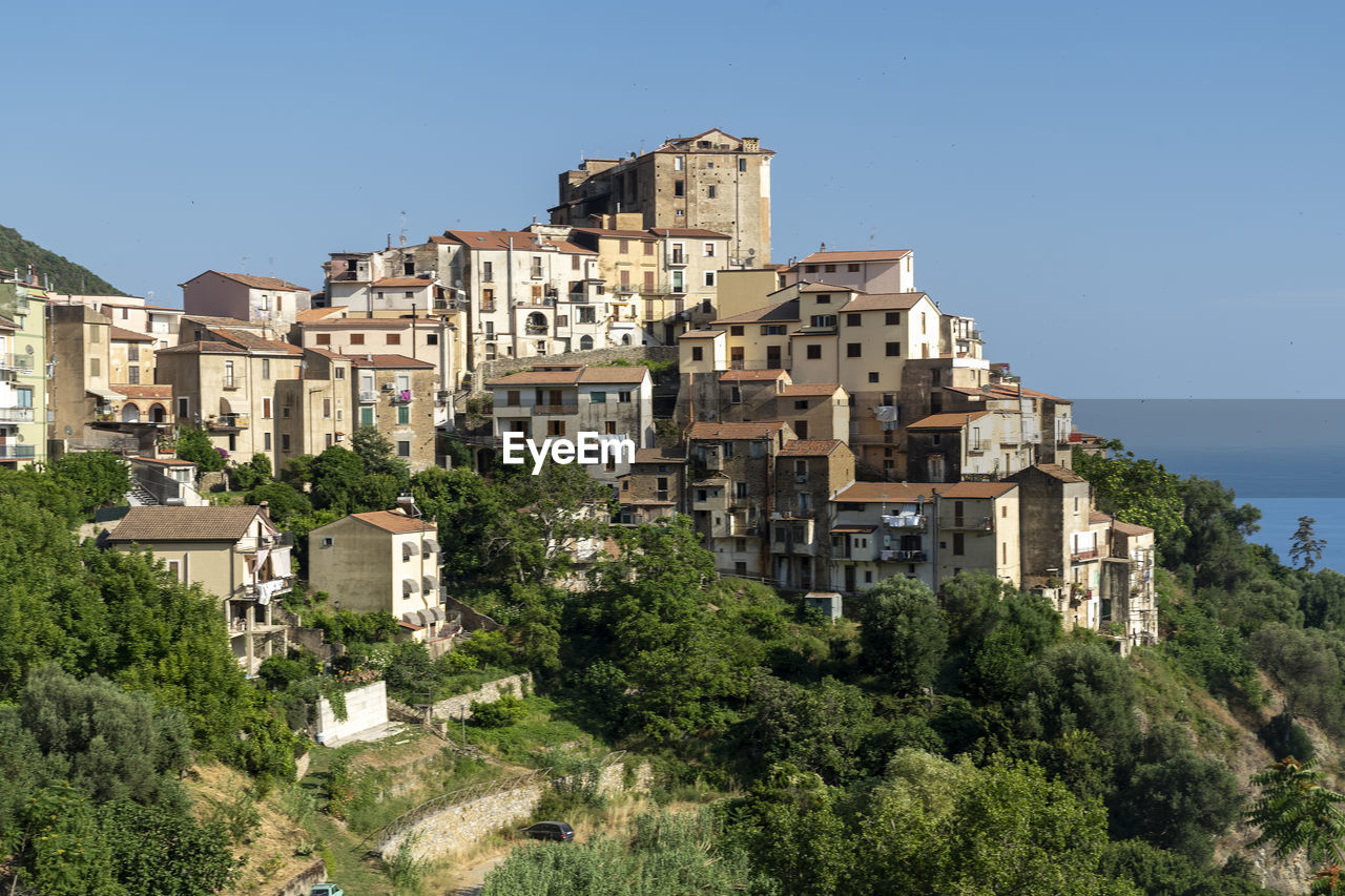 Low angle view of buildings against blue sky