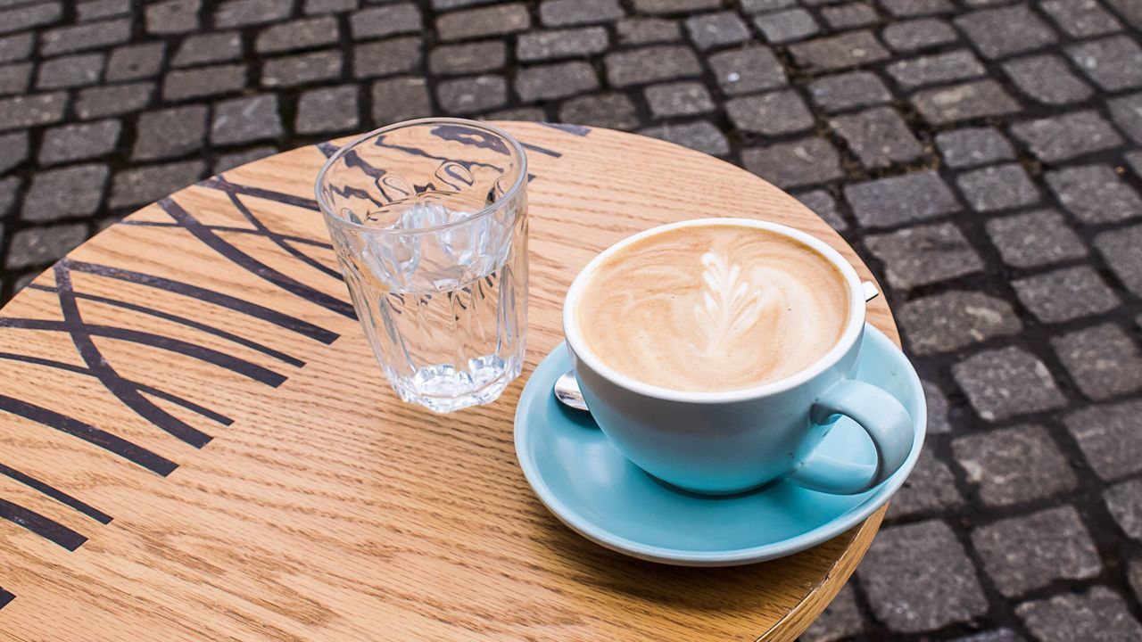 HIGH ANGLE VIEW OF COFFEE AND TABLE