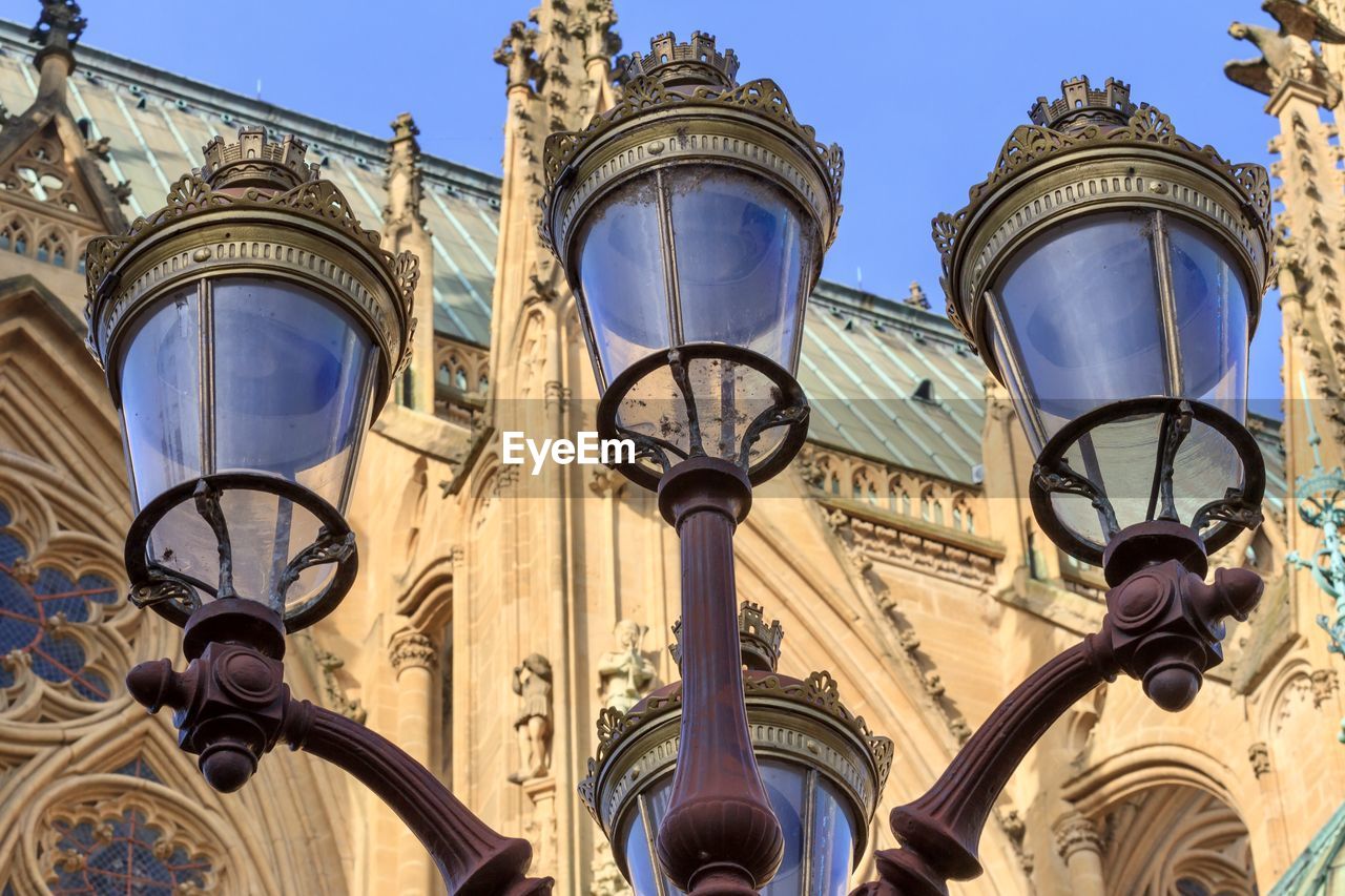 Low angle view of street light against building