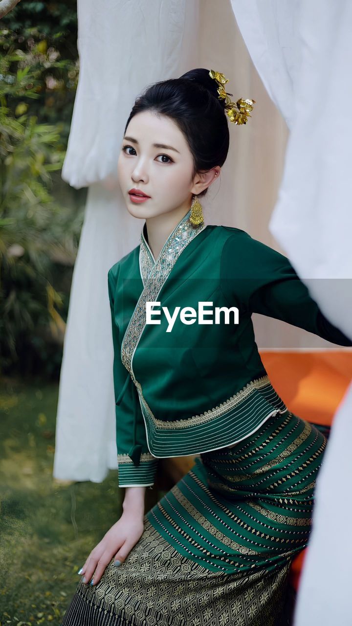 Young woman wearing thailand dress traditional clothes