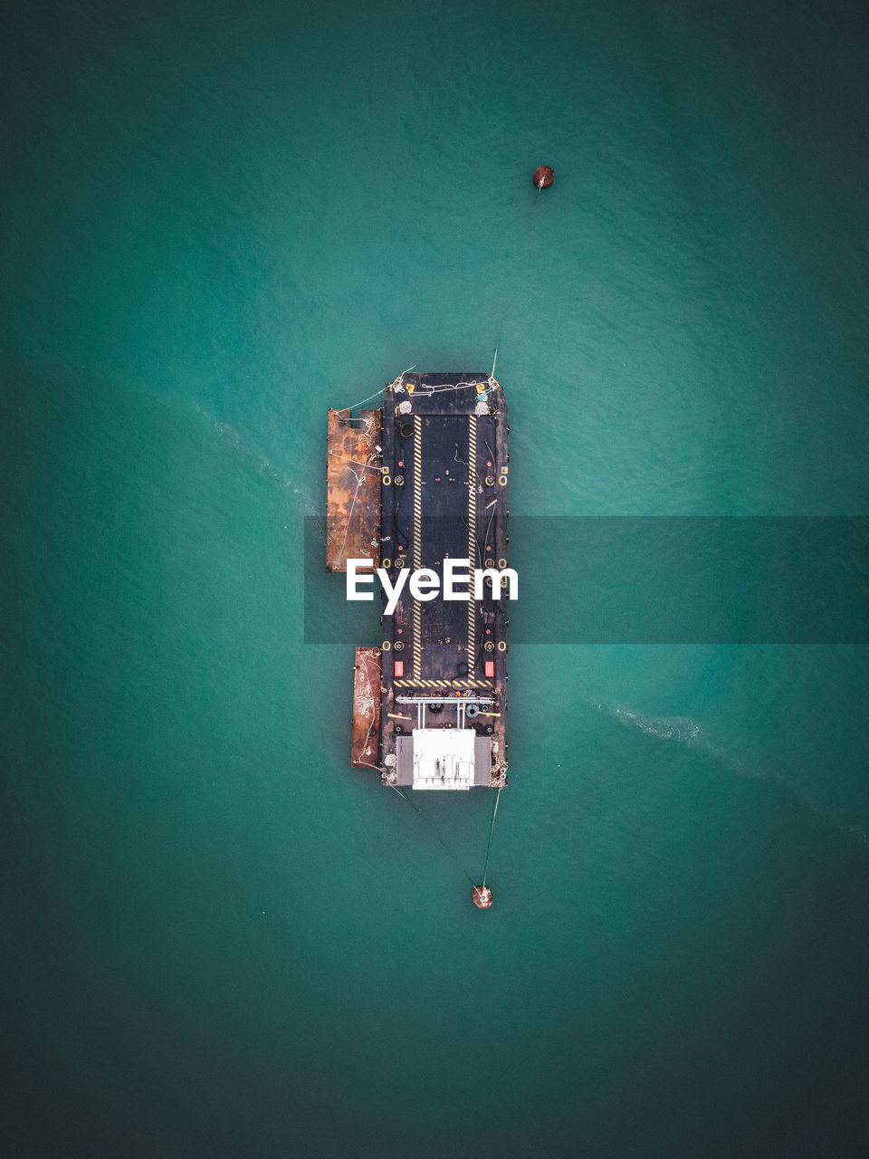 High angle view of carrier ship floating on sea