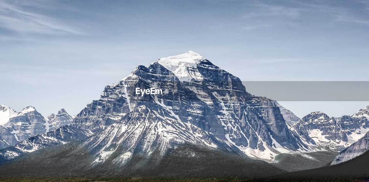 Scenic view of snowcapped mountain against sky