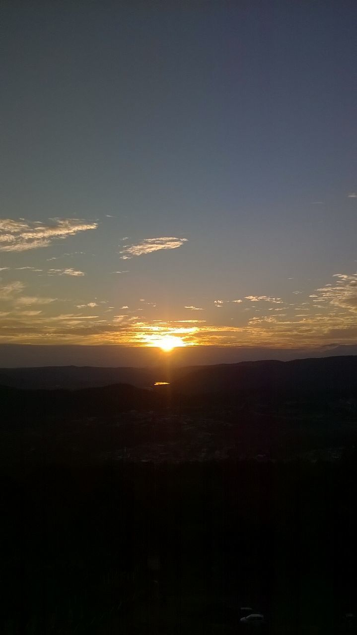 SUNSET OVER LANDSCAPE