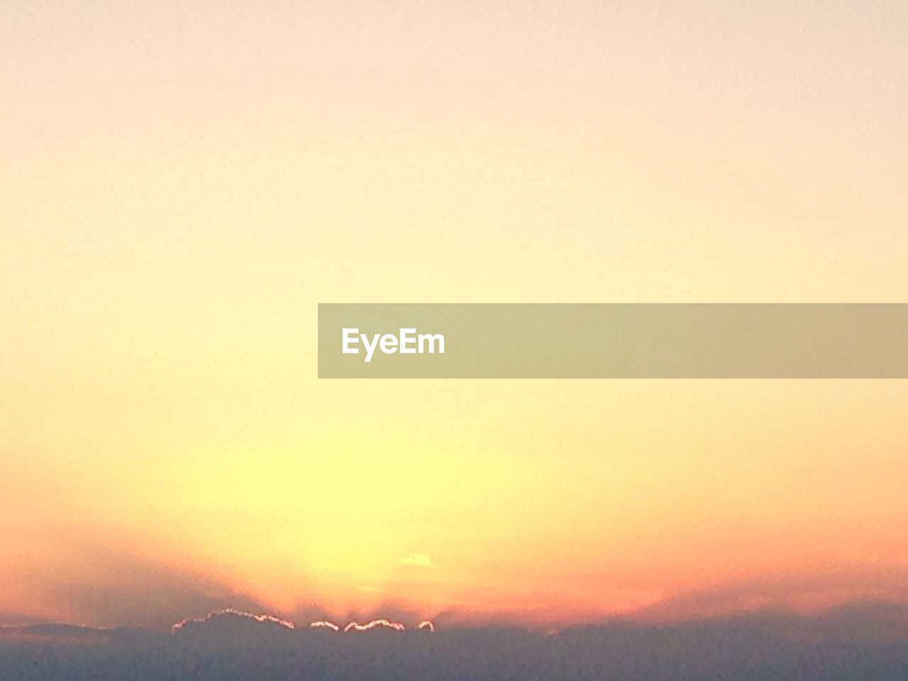 SCENIC VIEW OF SILHOUETTE MOUNTAIN AGAINST ORANGE SKY