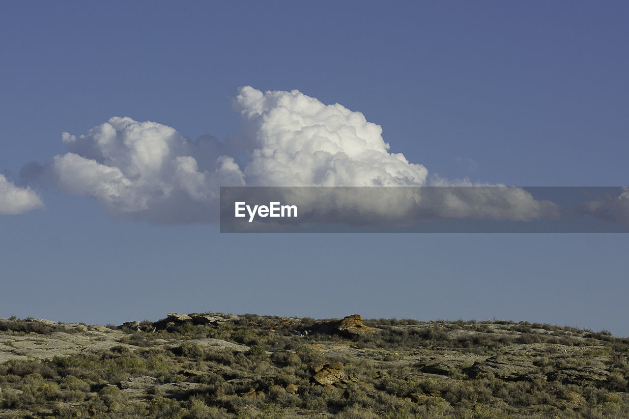 Low angle view of landscape against sky