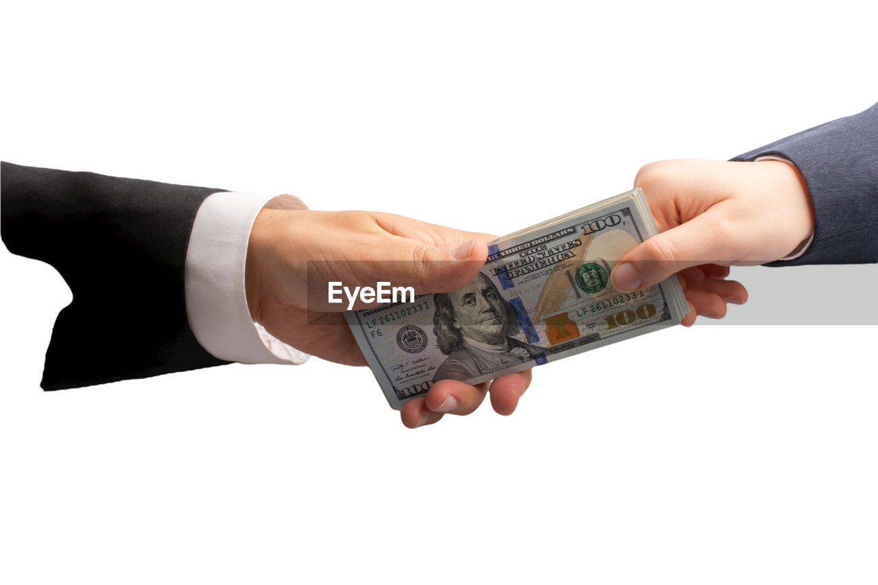 business, finance, currency, paper currency, cash, wealth, hand, corporate business, arm, businessman, business finance and industry, person, paying, finger, adult, cut out, giving, formal wear, success, men, finance and economy, clothing, money, exchanging, white background, banking, buying, holding, retail, debt, dollar, sale, savings, selling, money handling, commercial activity, agreement, studio shot, investment, occupation, banknote, sales occupation