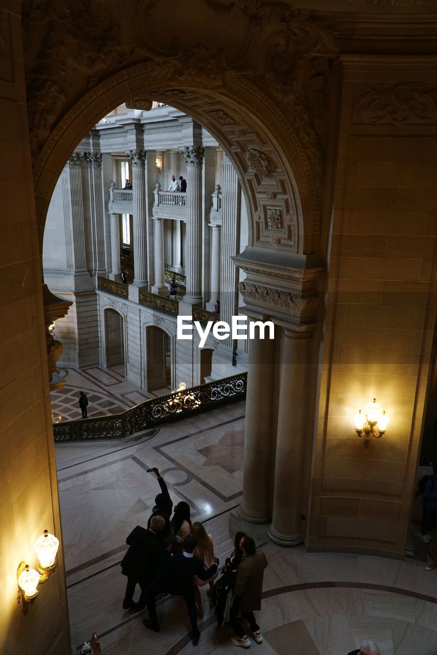 High angle view of people in corridor of building