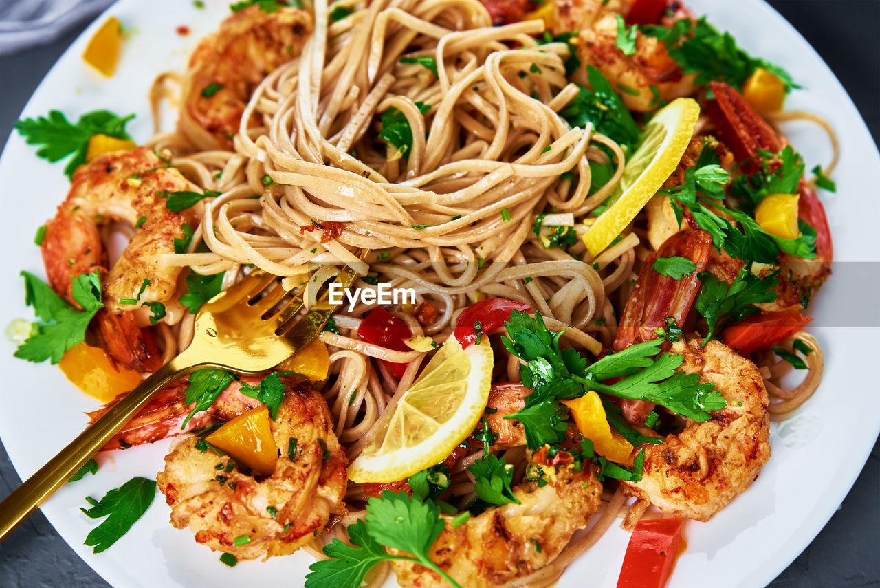 Stir fry noodle with shrimps, asian cuisine, cooked soba