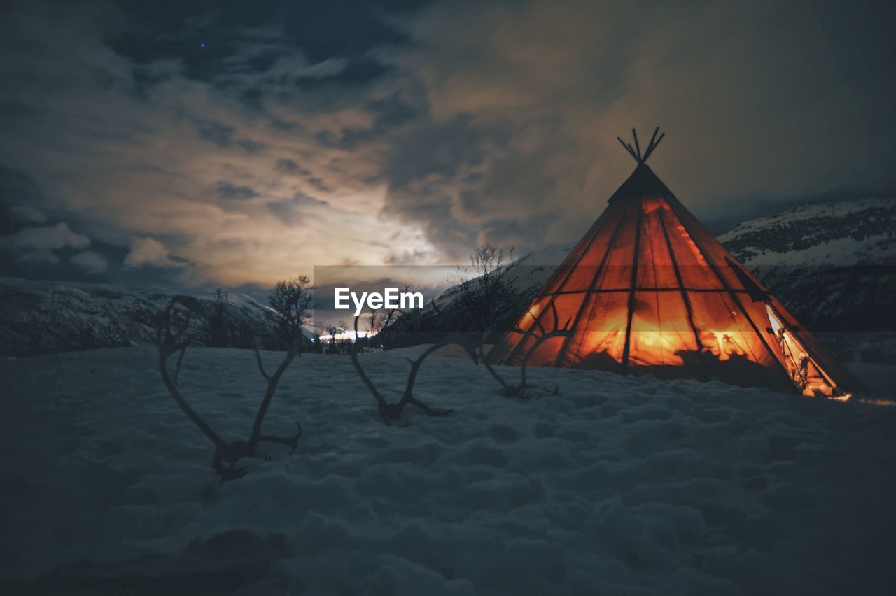 Tent on snow covered landscape