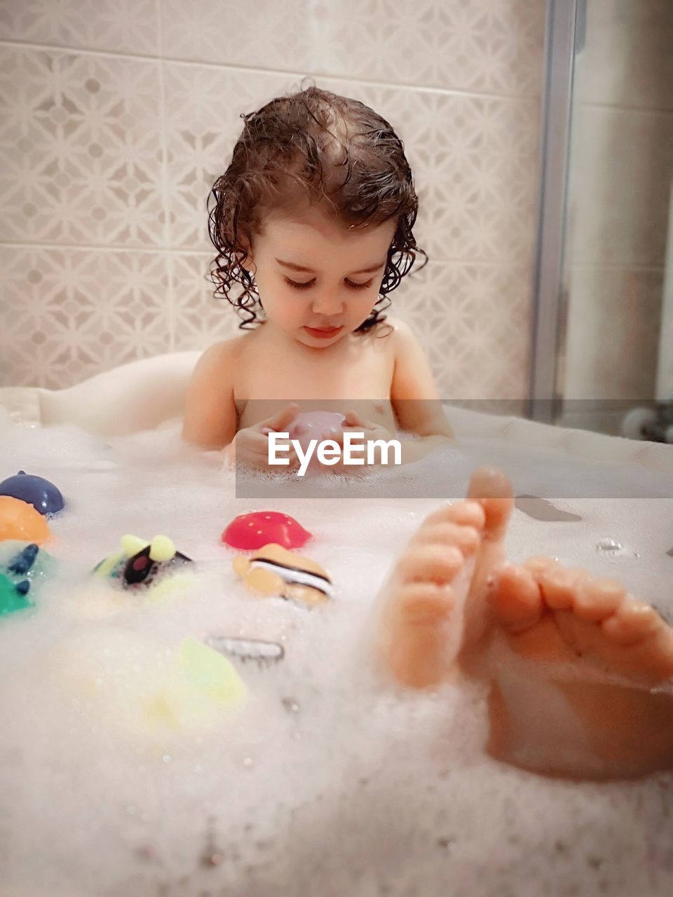 Full length of cute girl in bathtub