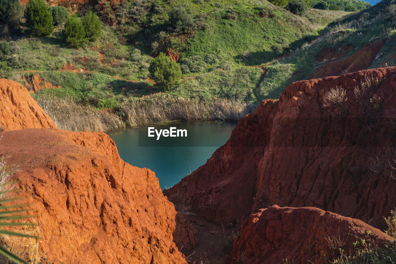 Scenic view of lake amidst bauxite cave