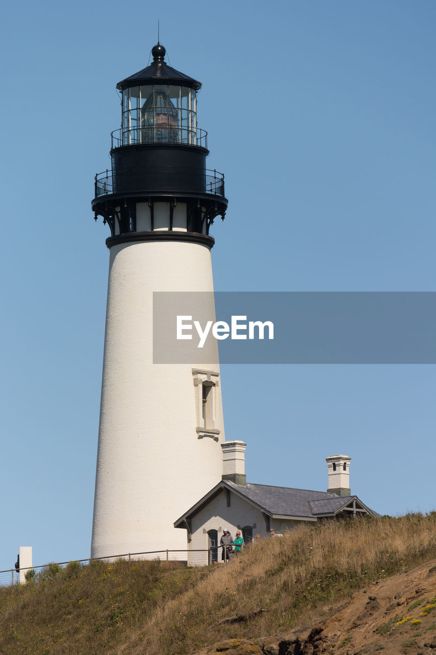 Yaquina head light against clear blue sky