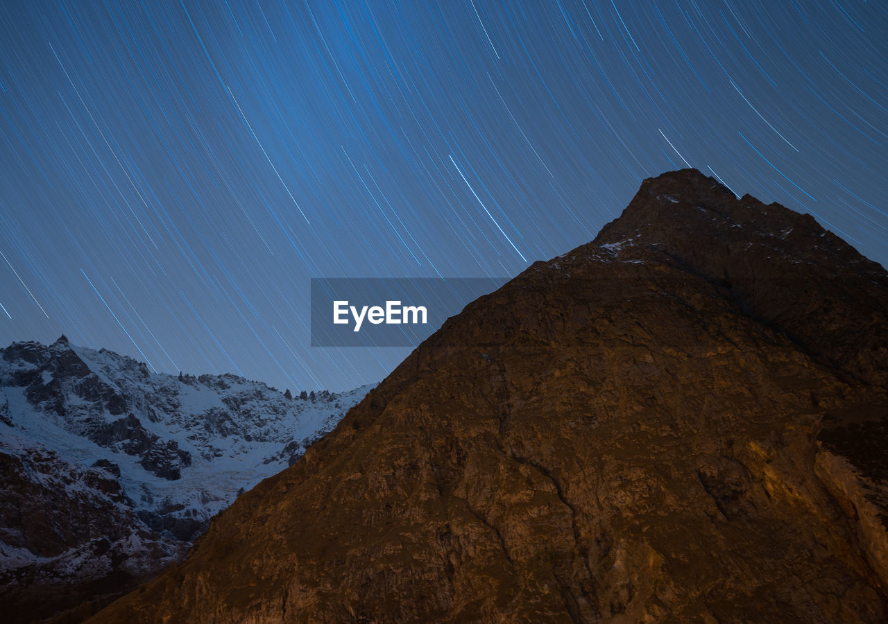 Star trail in la fouly switzerland with a view from the swiss alps mountains